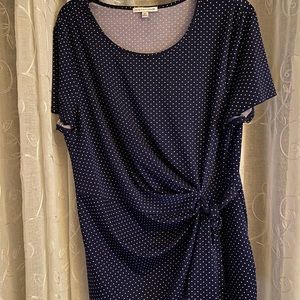 Dark blue, short sleeved, white polka-dotted shirt